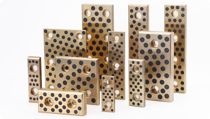 그리스나 오일 윤활을 사용하는 표준 베어링과 비교하여 자가 윤활 베어링을 사용하는 주요 장점은 무엇입니까?